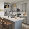 kitchen with large island and grey cabinents